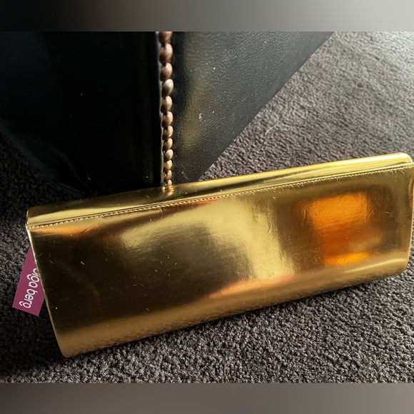 NWT - Olga berg gold clutch bag. NWT. Comes with chain strap. Rectangular clasp. - Picture 4 of 15